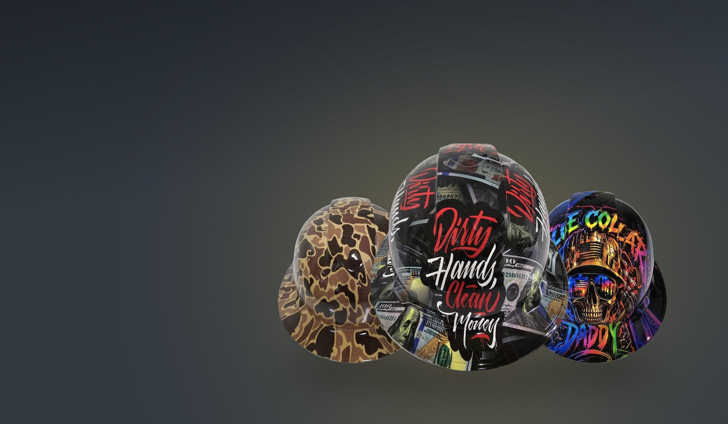 Three custom hydro dipped full brim hard hats: duck camo, Dirty Hands Clean Money, and Blue Collar Daddy